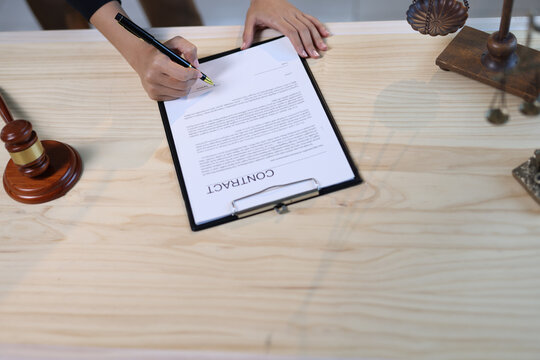 Lawyer reviewing contract document. Professional lawyer or attorney analyzing legal contract.
