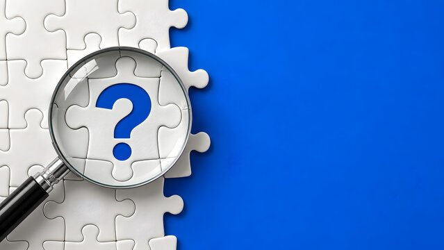 Magnifying Glass Focusing on a Question Mark Puzzle Piece
