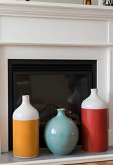 Naklejka premium Interior design and home decor, colorful ceramic vases on a fireplace mantel for modern living room styling and minimalist house staging