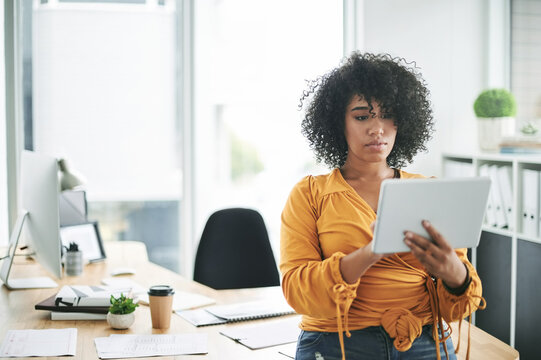 Tablet, office and business woman online for research, event budget or planning. Technology, serious and coordinator with app in workplace for finance, venue cost or reading email in creative startup