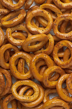 A background of scattered delicious pretzels, top view.