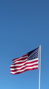 American Flag Against a Blue Sky wih Space for Copy