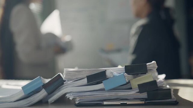Stack of Business Documents Showing Paperwork Overload and Heavy Office Workload