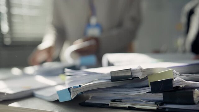 Stack of Office Documents Showing Heavy Workload and Paperwork Overload