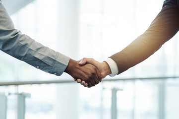 Business people, promotion or handshake in company for teamwork, investment or B2B deal agreement. Meeting, executive director or entrepreneur greeting investor for collaboration, support or funding © peopleimages.com