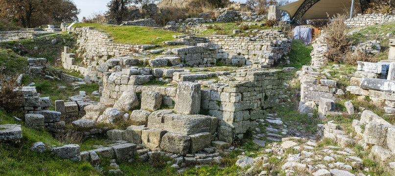 Panoramic view of ancient stone citadel ruins at the UNESCO archaeological site of Troy, legendary Ilion where Achaeans and Trojans fought in the Trojan War of Homer Iliad.