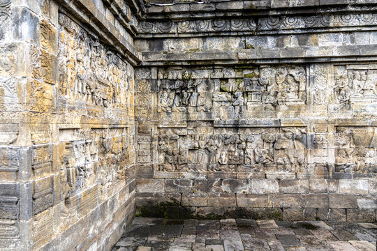 Ancient stone stupas of Borobudur, a UNESCO World Heritage Buddhist monument in Central Java, Indonesia, under an overcast sky.