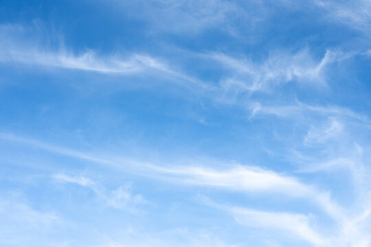The sky is a vibrant, cloudless blue, while the sun shines brightly, making it appear even more radiant.