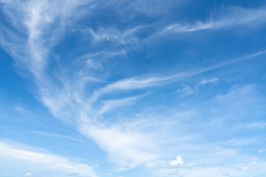 The sky is a vibrant, cloudless blue, while the sun shines brightly, making it appear even more radiant.
