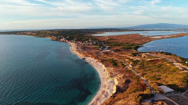 Scenic aerial drone flight landscape of Capo San Marco beach, Isthmus of San Giovanni di Sinis, Cabras, Oristano, Sardinia, Italy