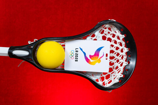 ZhongShan GuangDong China-September 5 2026: LA2028 Olympic lacrosse stick holding yellow ball and event tag.