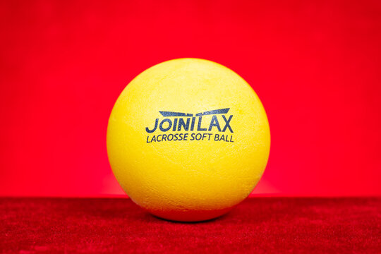 ZhongShan GuangDong China-September 9 2026: JOINILAX lacrosse soft ball on red.