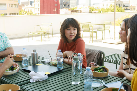 People Sharing Lunch on a Rooftop