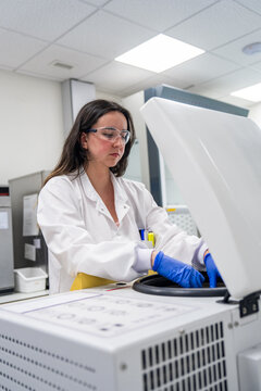 Scientist Working in a Laboratory Setting With Equipment