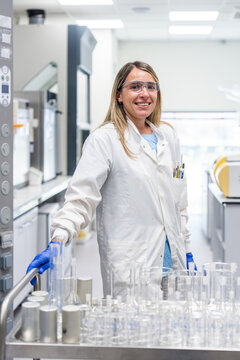 Scientist Works in Laboratory With Glassware and Equipment