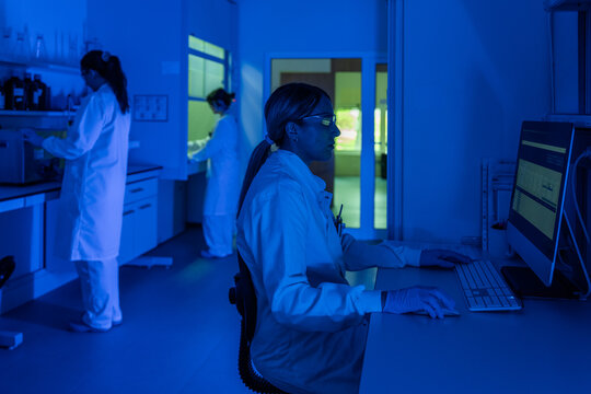 Laboratory Workers Conducting Research in Evening Light