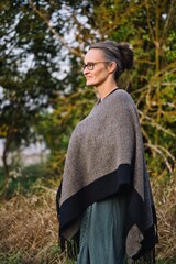 Mature woman enjoying a peaceful moment in nature © Steve