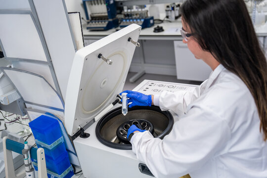Scientist Using Centrifuge in a Laboratory