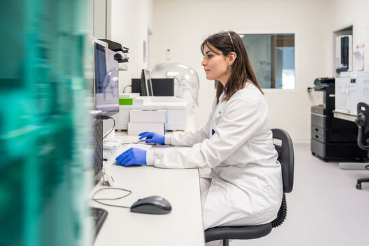 Lab Worker Conducts Research at a Modern Facility in a Laboratory