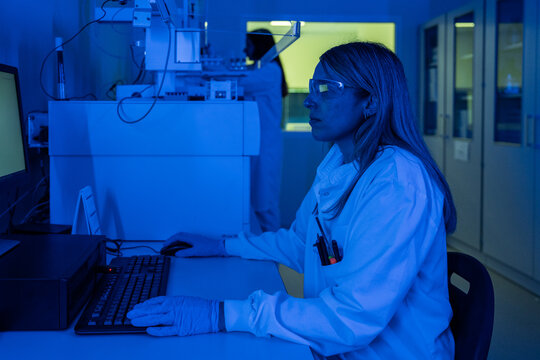 Scientist Works in Laboratory With Blue Lighting