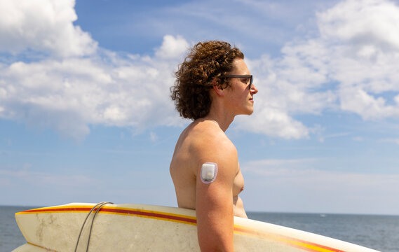 Man side view  wear Continuous Glucose Monitor diabetic Portrait