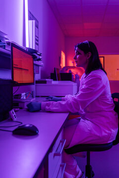 Scientist Works at a Computer in a Lab During Evening Hours