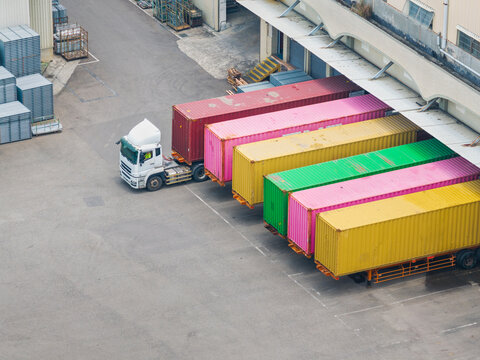 Aerial View of Truck and Colorful Containers at Warehouse