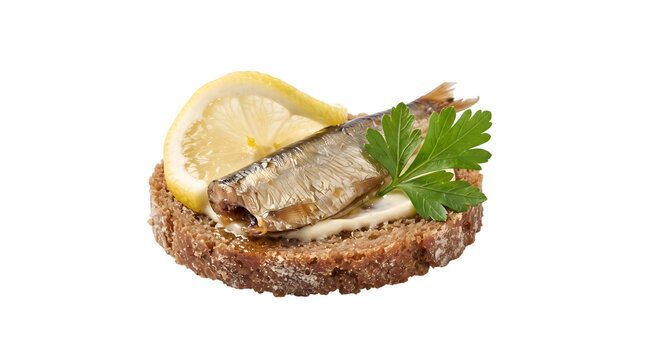Smoked sprat sandwich on dark rye bread with fresh lemon slice and parsley isolated on white background