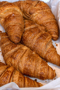 Fresh  Croissants on a bakers stall at a food market