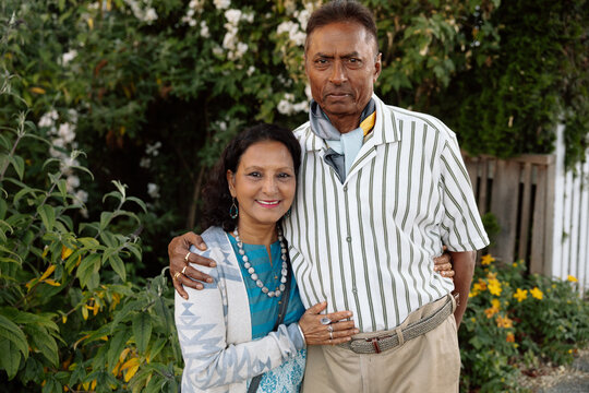 Loving senior couple portrait outdoors showing warm connection