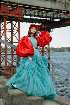 Cowgirl in red cowboy hat and Oversize Red Sleeves and blue dress
