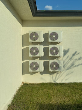 Air Conditioner Outdoor Units With Shadows On Wall