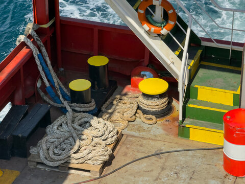 Mooring Bollards Ropes And Lifebuoy On Ship Deck