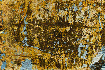 ancient wall texture with peeling paint and yellow and blue tones © Nacho