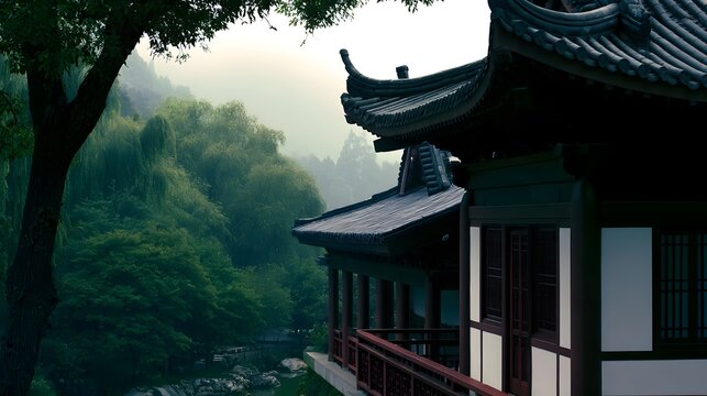 Traditional Chinese pavilion with curved roof overlooks lush green forest and misty valley below