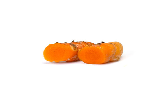 Organic turmeric root closeup white backdrop