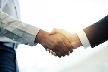 Business people, equity or handshake in company for deal,, investment space and B2B agreement. Meeting, executive director or entrepreneur greeting investor for collaboration, support and funding © peopleimages.com