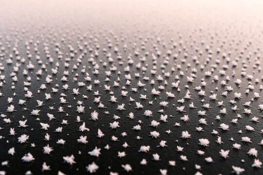 Macro of Frost Crystals on a Dark Surface