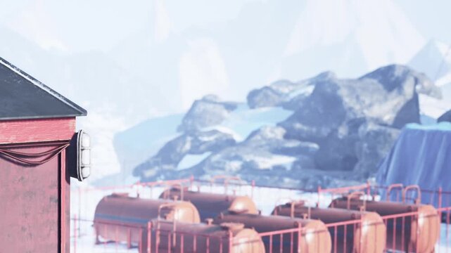A vibrant red building stands against a backdrop of icy mountains and rocky landscapes. Wisps of fog linger in the air, creating an ethereal atmosphere at this remote location.