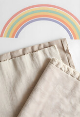 Fototapeta premium Sustainability and eco friendly textile design, natural linen fabric swatches with rainbow illustration for sustainable fashion and interior decor