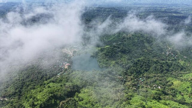 Aerial view of Boga Lake surrounded by foggy clouds
