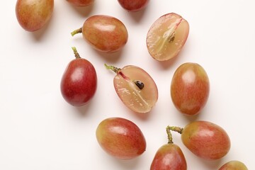 Fototapeta premium Fresh ripe grapes on white background, flat lay