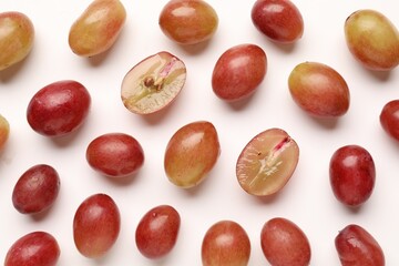 Fototapeta premium Fresh ripe grapes on white background, flat lay