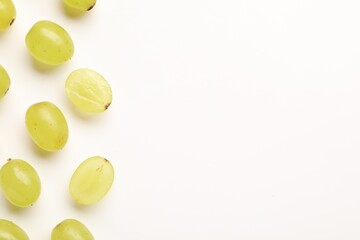 Fototapeta premium Fresh ripe grapes on white background, flat lay