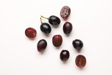 Fototapeta premium Fresh ripe grapes on white background, flat lay