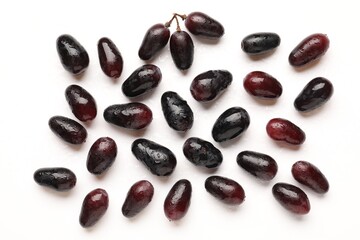 Fototapeta premium Fresh ripe grapes on white background, flat lay