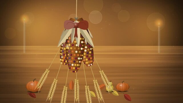 Warm Thanksgiving corn and wheat bundle with ribbon on rustic wood
