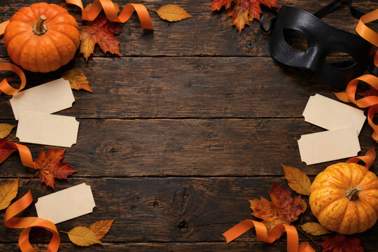 Halloween flat lay with pumpkins mask and blank tickets