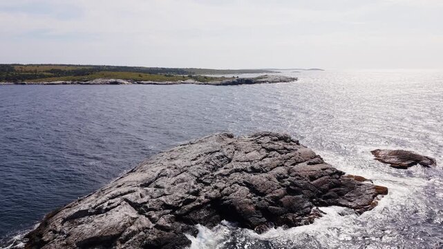 Aerial view of a Canadian maritime landscape with rocky islands off the coast of Prospect, Nova Scotia, Canada, surrounded by the vast Atlantic Ocean.
