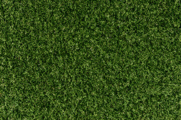 Fototapeta premium A top-down aerial photo texture of lush green sports field grass, suitable for a golf course, soccer field, football pitch, or rugby turf.